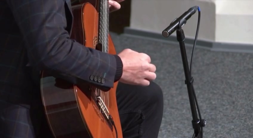 Right hand detail on the strings of a classical guitar